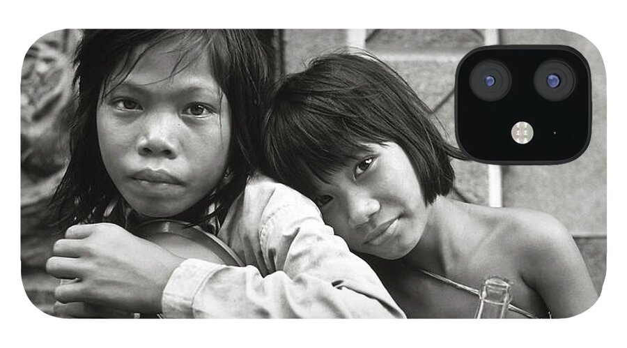 Black And White iPhone 12 Case featuring the photograph Sisters from Cambodia in Saigon by Silva Wischeropp