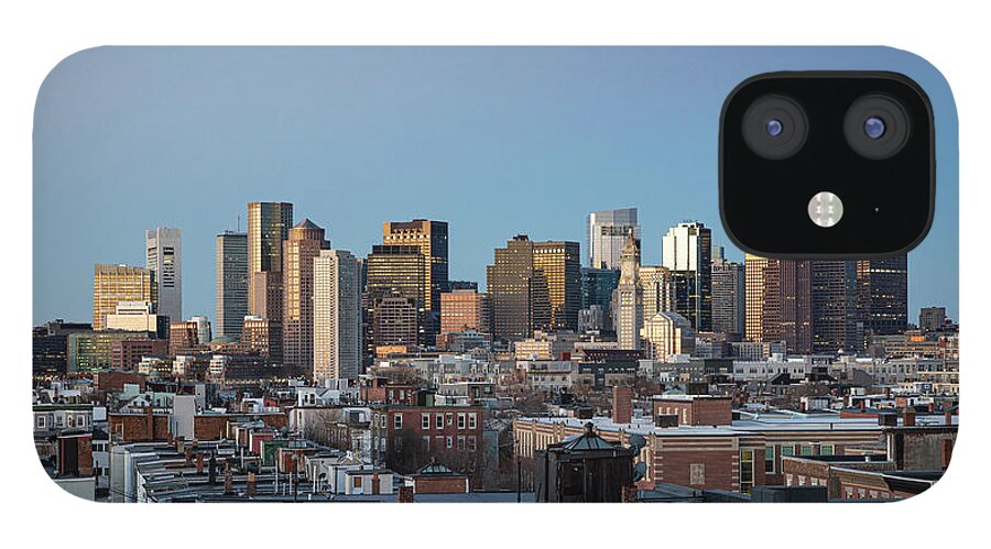 America iPhone 12 Case featuring the photograph The skyline of Boston in Massachusetts, USA on a clear Winter ev by Kyle Lee