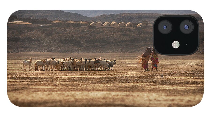 Scenics iPhone 12 Case featuring the photograph Two People With Herd Of Goats, Lac by Cultura Rm Exclusive/romona Robbins Photography
