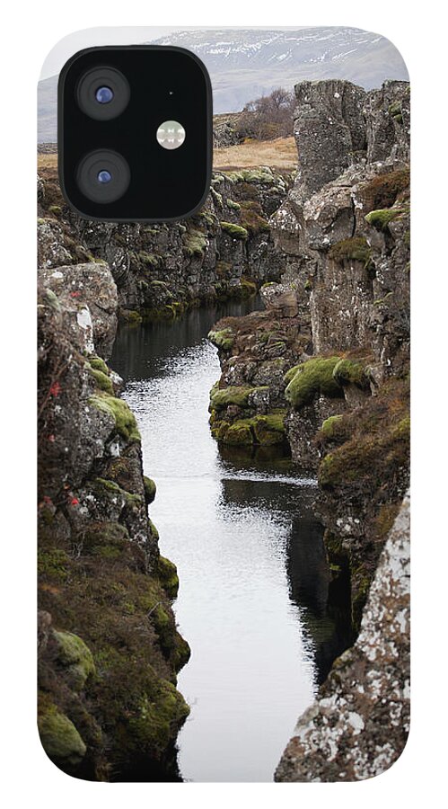 Scenics iPhone 12 Case featuring the photograph View Between A Ravine, Thingvellir by Halfdark