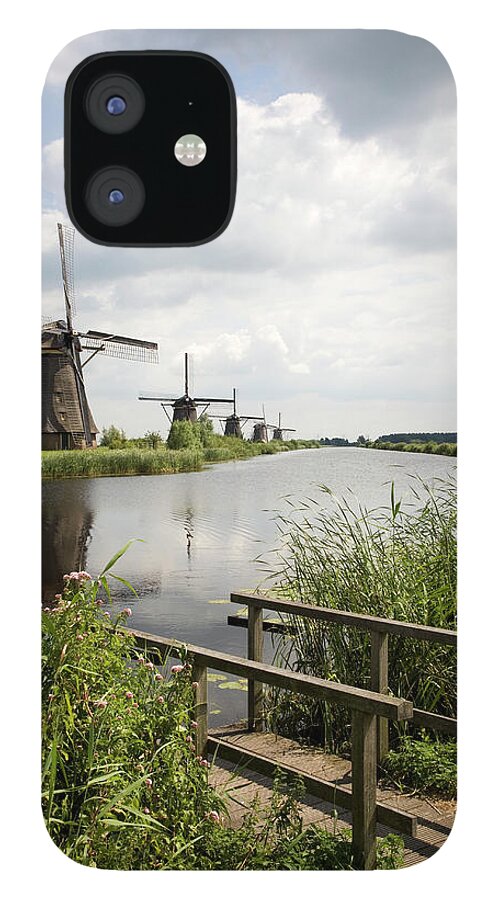 Scenics iPhone 12 Case featuring the photograph Windmills Of Kinderdijk, Netherlands by Roel Meijer
