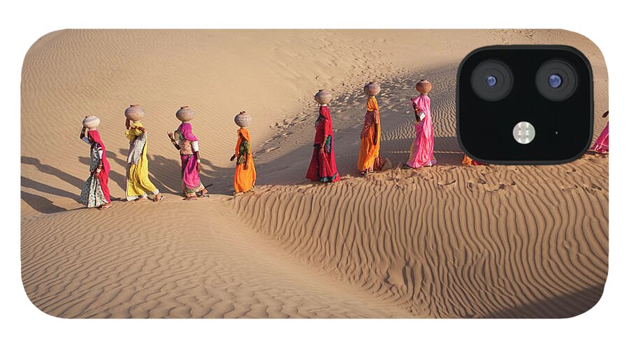 People iPhone 12 Case featuring the photograph Women Fetching Water From The Sparse by Mint Images - Art Wolfe