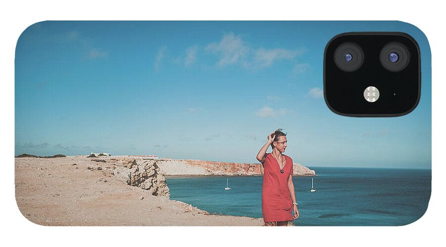 Adult iPhone 12 Case featuring the photograph Young Woman On Cliff Looking Out Over Ocean In Summer In Portugal by Cavan Images