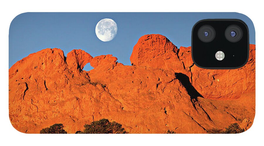 Moonset iPhone 12 Case featuring the photograph Full Moon Kissing Camels by Bob Falcone