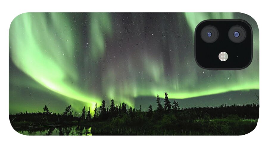 Northern Lights iPhone 12 Case featuring the photograph The Aurora Borealis fills the sky by Steven Upton