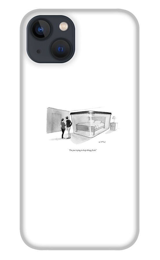 A Couple Looks At A Bed Encased In A Giant iPhone 13 Case