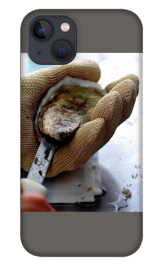 An Oytser Being Shucked iPhone 13 Case