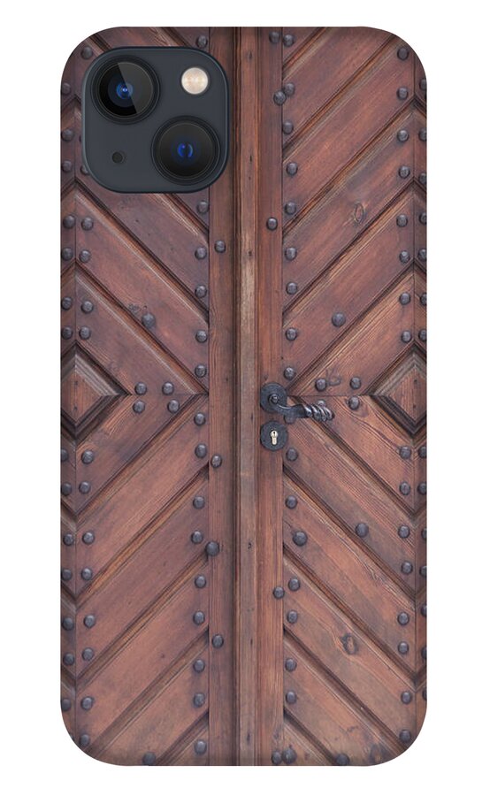 Material iPhone 13 Case featuring the photograph Vintage Wooden Brown Door Close-up by Bogdan Khmelnytskyi