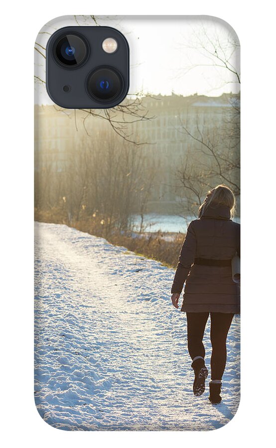Mature Adult iPhone 13 Case featuring the photograph Woman Walking Along Path With by Ascent/pks Media Inc.