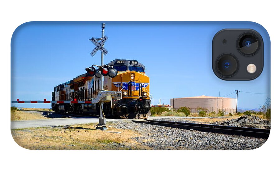Railway Crossing; Railroad Crossing; Train Crossing; Union Pacific; Freight Train; Yellow; Blue; Green; Red; Water Storage; Train Tracks; Train Signal; Mojave Desert; Mohave Desert; Antelope Valley; Joe Lach iPhone 13 Case featuring the photograph Railway Crossing by Joe Lach
