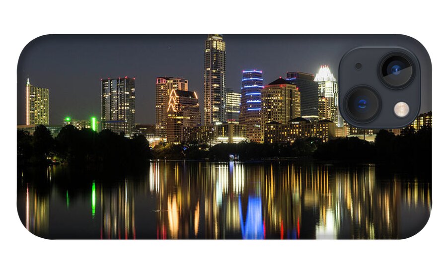 Austin Skyline Pictures iPhone 13 Case featuring the photograph The glimmering Austin Skyline sparkles at night with a view from the Boardwalk Trail on Lady Bird Lake by Dan Herron