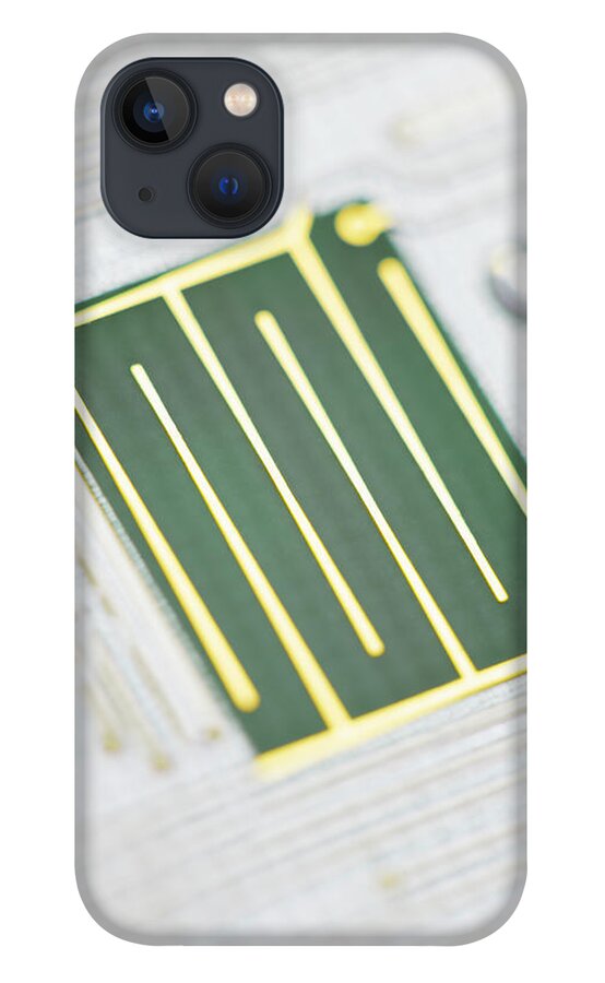 Tin iPhone 13 Case featuring the photograph Close-up Of A Circuit Board by Nicholas Rigg