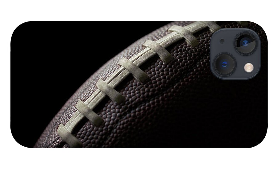 American Football iPhone 13 Case featuring the photograph Black Football On A Black Background by Gregchristman