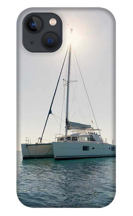 Catamaran iPhone 13 Case featuring the photograph Catamaran Boat On Sea Against Clear Blue Sky During Summer by Cavan Images