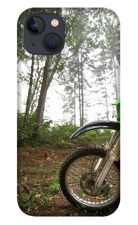 Outdoors iPhone 13 Case featuring the photograph Close-up Of Motorcycle In Forest by Thomas Northcut