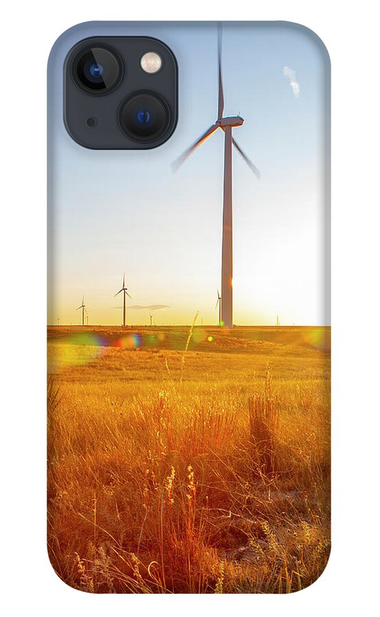 Sun Flare iPhone 13 Case featuring the photograph Colorado Wind Farm Located On A Wheat Field During Sunrise by Cavan Images