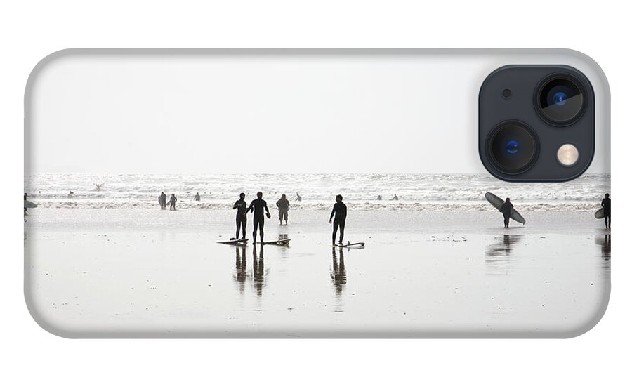 Part Of A Series iPhone 13 Case featuring the photograph Group Of Surfers Walking On Beach by Ashley Jouhar