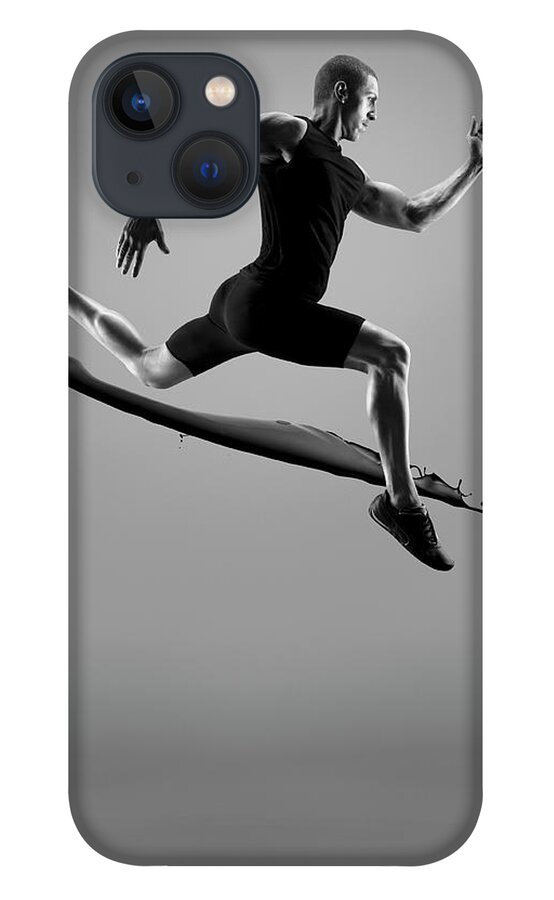People iPhone 13 Case featuring the photograph Male Athlete Running Above Liquid Splash by Jonathan Knowles