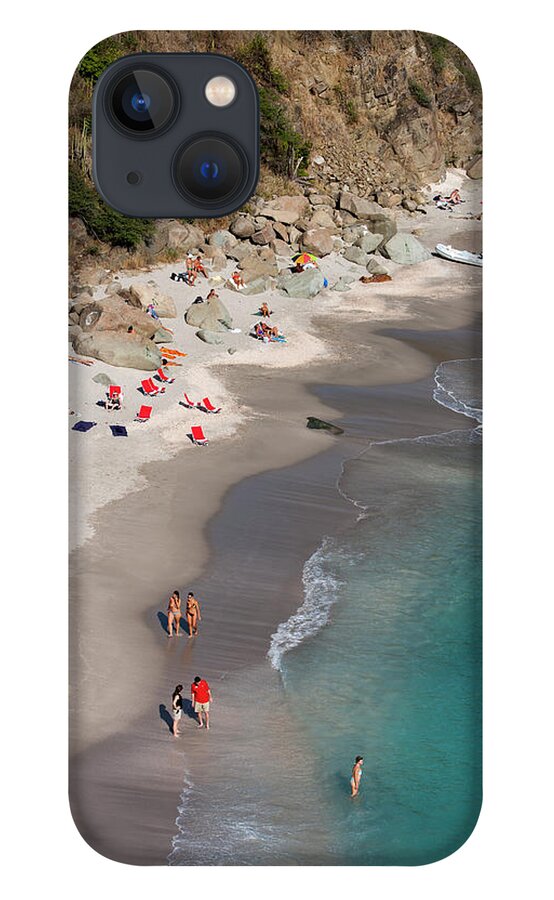 Water's Edge iPhone 13 Case featuring the photograph People Relax On Shell Beach by Holger Leue