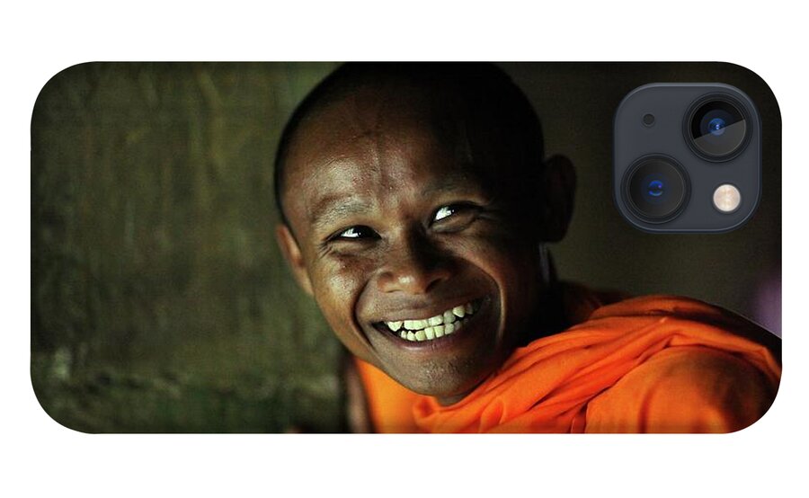 Orange Color iPhone 13 Case featuring the photograph Smiling Buddhist Monk At Angkor Wat by Timothy Allen