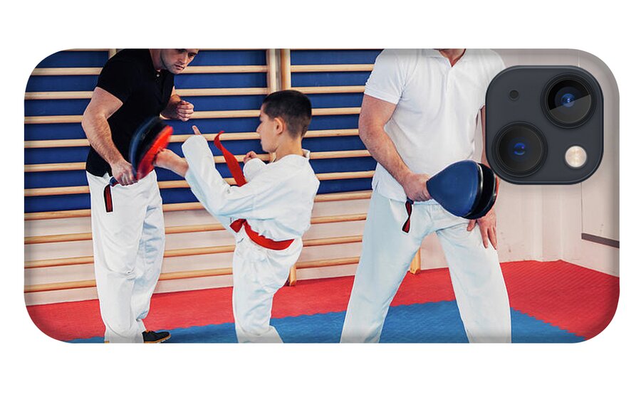 Tae Kwon Do iPhone 13 Case featuring the photograph Taekwondo Instructors Working With Boy by Microgen Images/science Photo Library