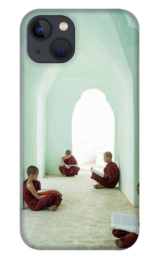Arch iPhone 13 Case featuring the photograph Young Buddhist Monks Reading In Temple by Martin Puddy