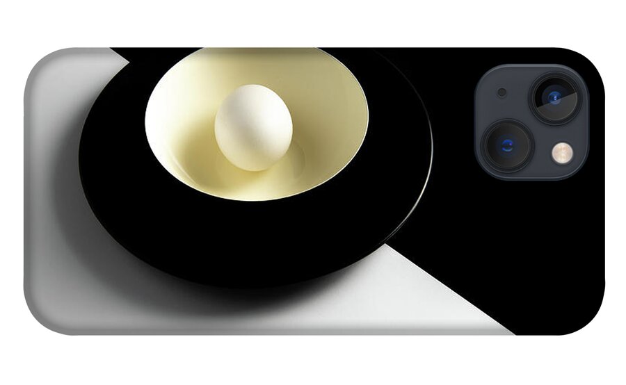 Still-life iPhone 13 Case featuring the photograph Single fresh white egg on a yellow bowl by Michalakis Ppalis