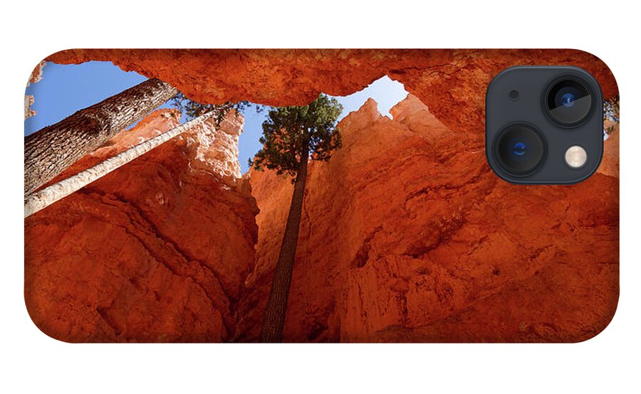 America iPhone 13 Case featuring the photograph Blue sky piercing between two orange cliffs by Jean-Luc Farges