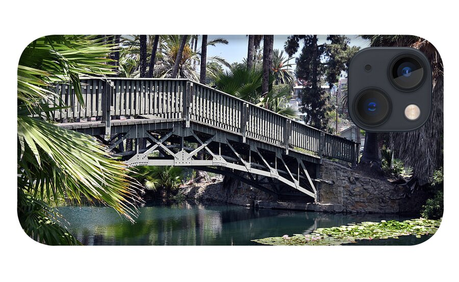 Lake iPhone 13 Case featuring the photograph Wooden bridge over a lily pond scenic landscape by Mark Stout