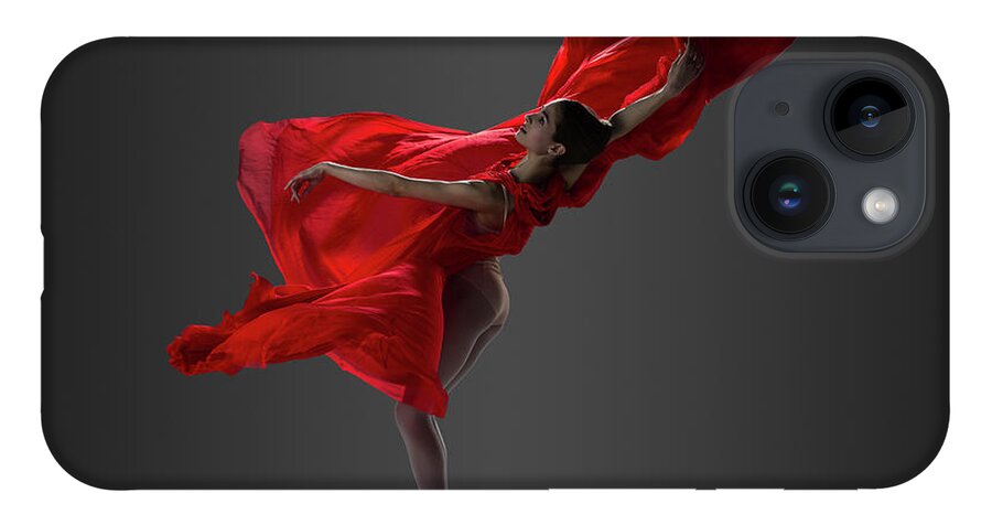 Ballet Dancer iPhone 14 Case featuring the photograph Ballerina Performing On Pointe In Red by Nisian Hughes