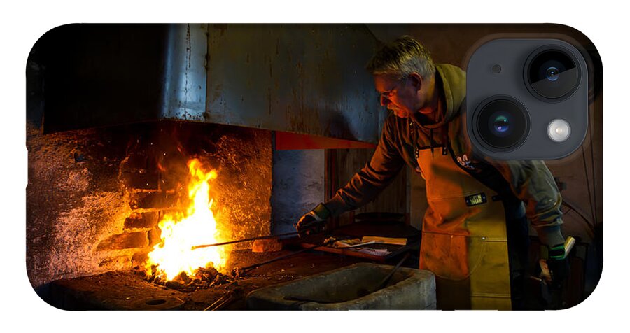 The Torresta Blacksmith iPhone Case featuring the photograph The Torresta Blacksmith by Torbjorn Swenelius
