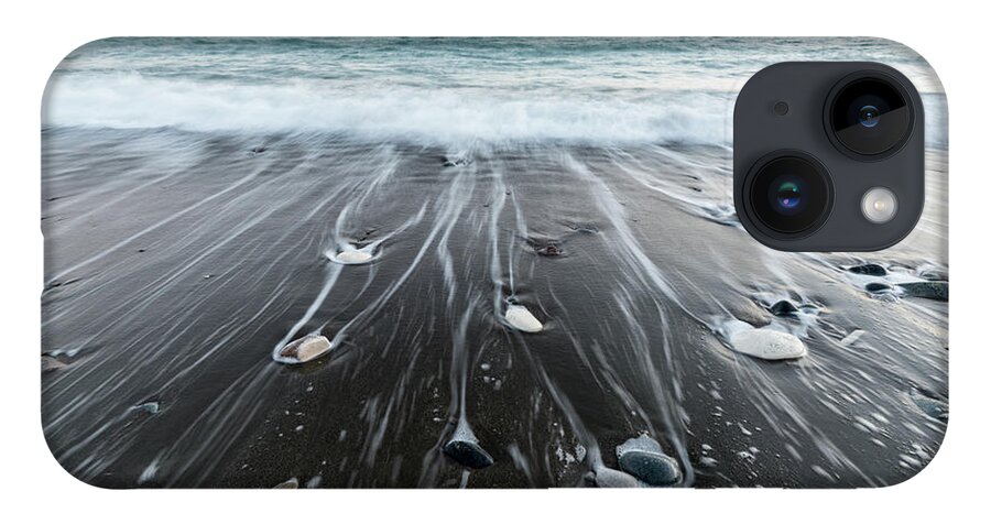 Seascape iPhone 14 Case featuring the photograph Pebbles in the beach and flowing sea water by Michalakis Ppalis