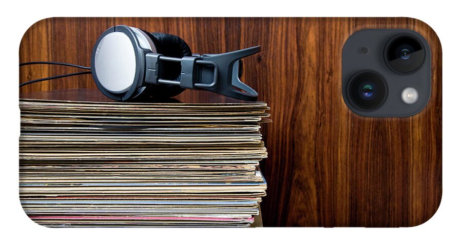 Technology iPhone 14 Case featuring the photograph Headphones Laying On Stack Of Vinyl by Steven Errico