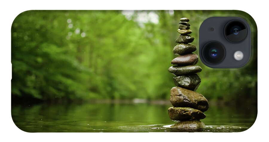 Tranquility iPhone 14 Case featuring the photograph Stack Of River Stones In Placid Water by Colin Mcdonald