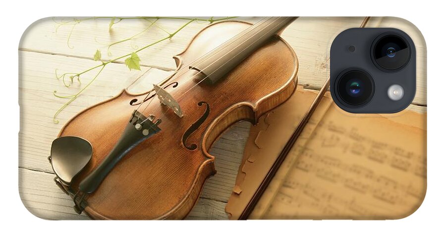 Sheet Music iPhone 14 Case featuring the photograph Violin And Music Sheet by Image Work/amanaimagesrf