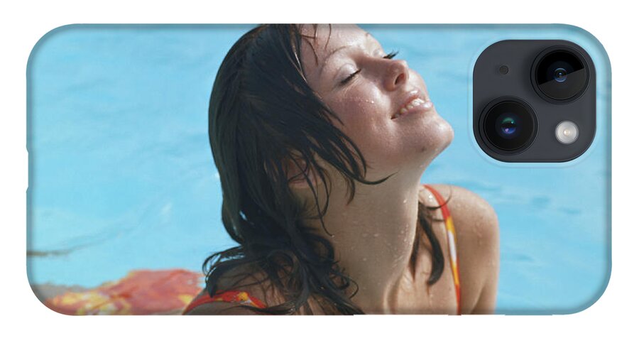 1973 iPhone 14 Case featuring the photograph Young Woman In Bikini At Swimming Pool by Tom Kelley Archive