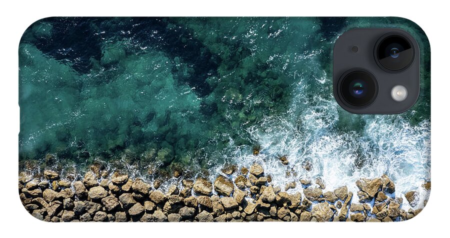 Seascape iPhone 14 Case featuring the photograph Aerial view from flying drone of crystal blue ocean water and sea wall. by Michalakis Ppalis