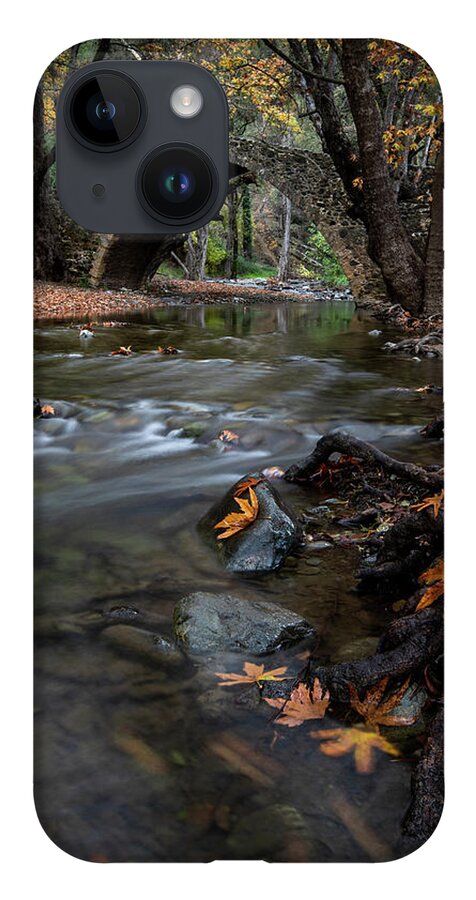 Autumn iPhone 14 Case featuring the photograph Autumn landscape with river flowing under a stoned bridge by Michalakis Ppalis
