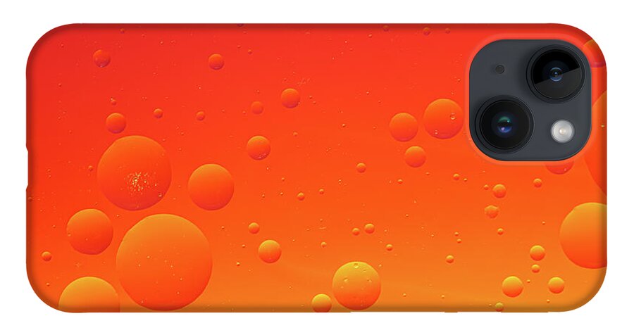 Abstract iPhone 14 Case featuring the photograph Bright abstract, red background with flying bubbles by Michalakis Ppalis