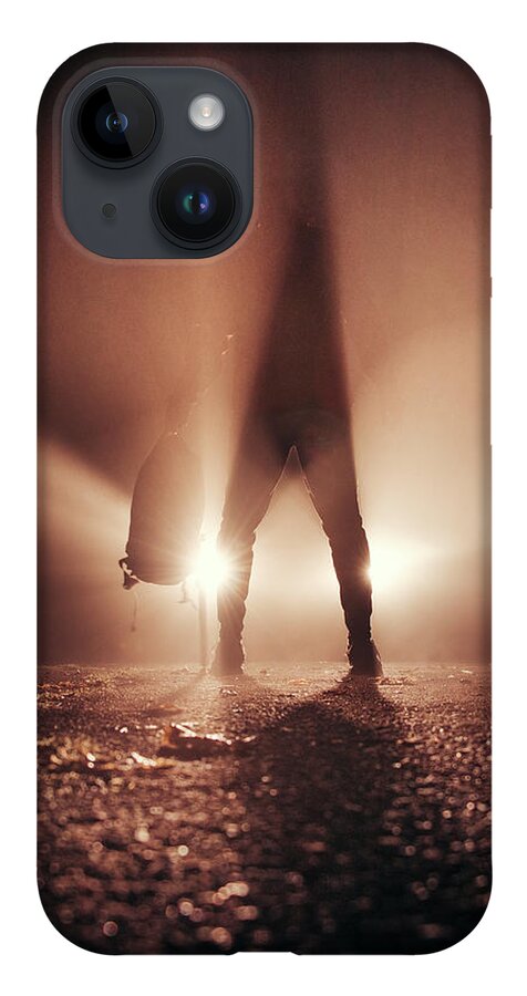 Figure iPhone 14 Case featuring the photograph Man stands in car lights by Vaclav Sonnek