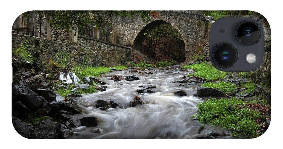 River iPhone 14 Case featuring the photograph Medieval stoned bridge water flowing in the river. by Michalakis Ppalis