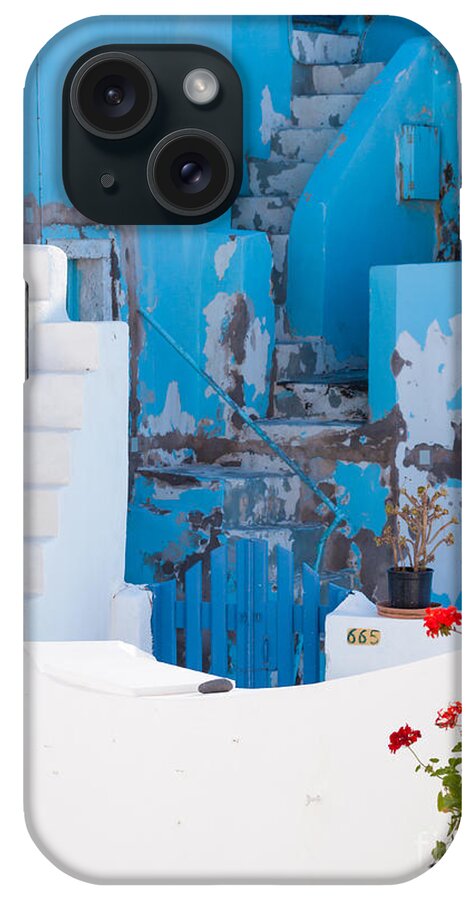 Glimpse iPhone Case featuring the photograph Glimpse of typical white houses in Oia Santorini Greece #1 by Matteo Colombo
