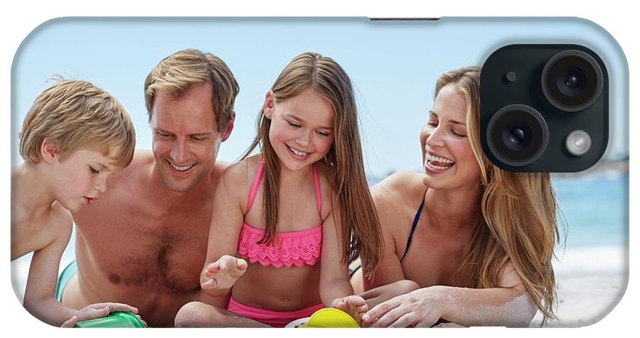 25-29 Years iPhone Case featuring the photograph Family On The Beach #2 by Science Photo Library