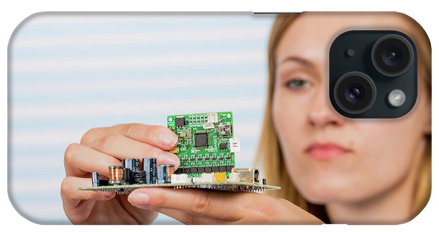 One Person iPhone Case featuring the photograph Female Electrical Engineer Fixing Circuit #2 by Wladimir Bulgar/science Photo Library
