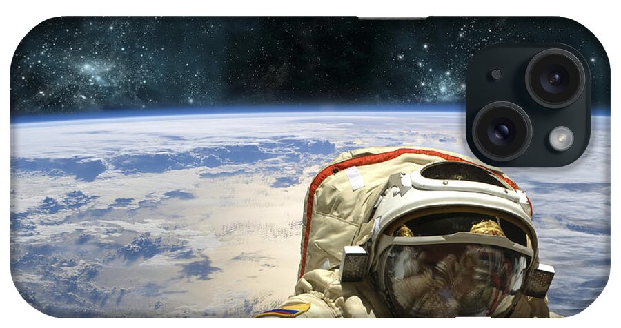 Astronaut iPhone Case featuring the photograph A Cosmonaut Floats In Space Above Earth by Marc Ward