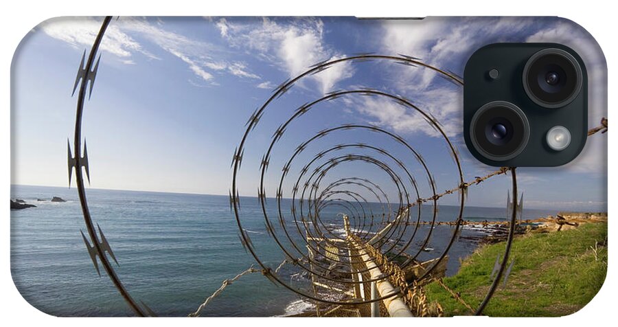 Barbed Wire iPhone Case featuring the photograph A Forced Perspective View Down A Ribbon by Jonathan Kingston