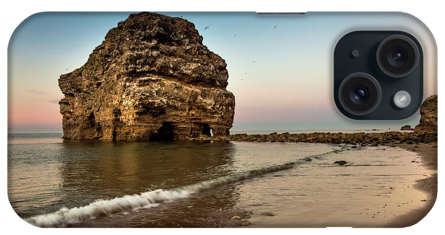 Flying iPhone Case featuring the photograph A Large Rock Formation On The Coast by John Short