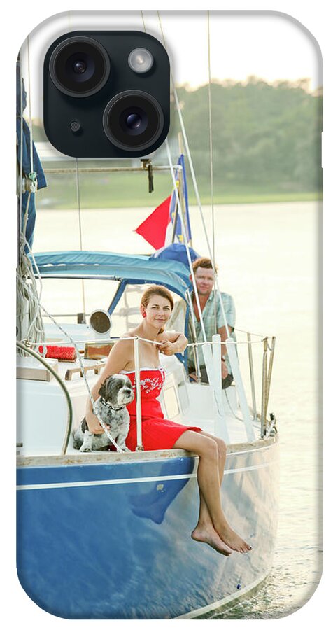 25-29 Years iPhone Case featuring the photograph A Man And A Woman On Sailboat by Eyeconic Images