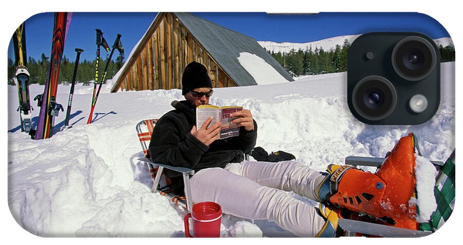 Adult iPhone Case featuring the photograph A Man Relaxing In The Snow by Corey Rich