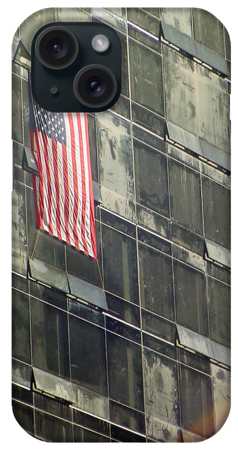 Sep. 11 iPhone Case featuring the photograph After Sep. 11 flag on Millennium hotel by Mieczyslaw Rudek